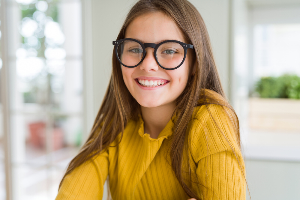 Beautiful Young Girl Kid Wearing glasses With smile